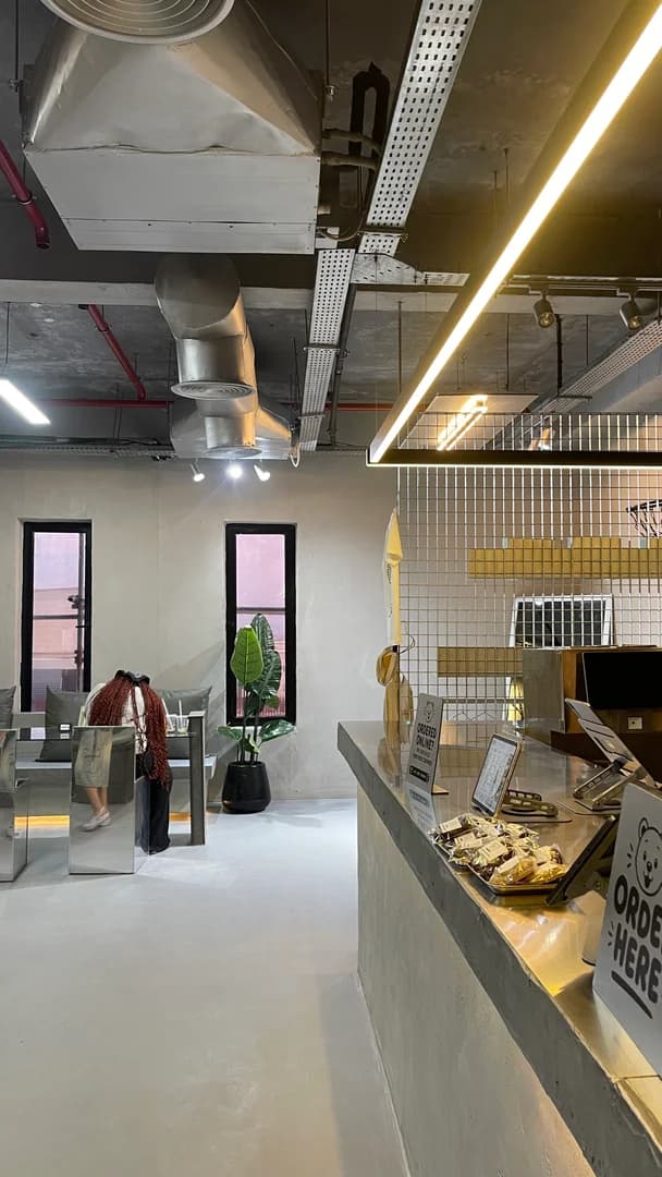 The Boba Chummy flagship storefront in Guzape, Abuja at blue hour.
