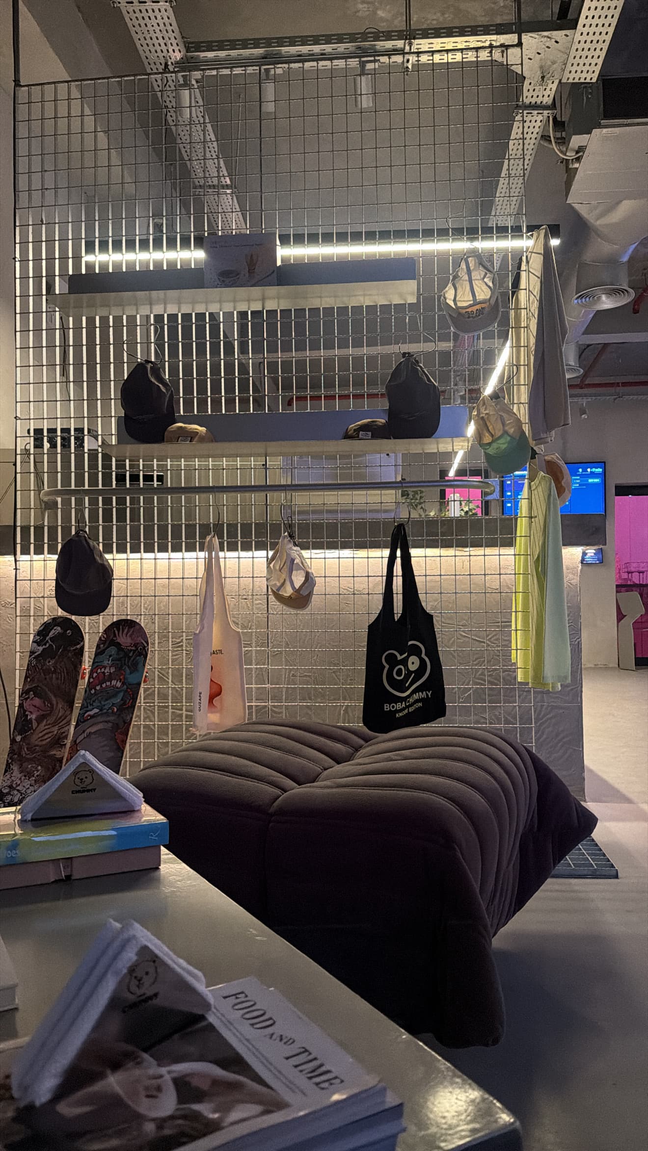 The merch and lounge corner inside the Boba Chummy Guzape flagship